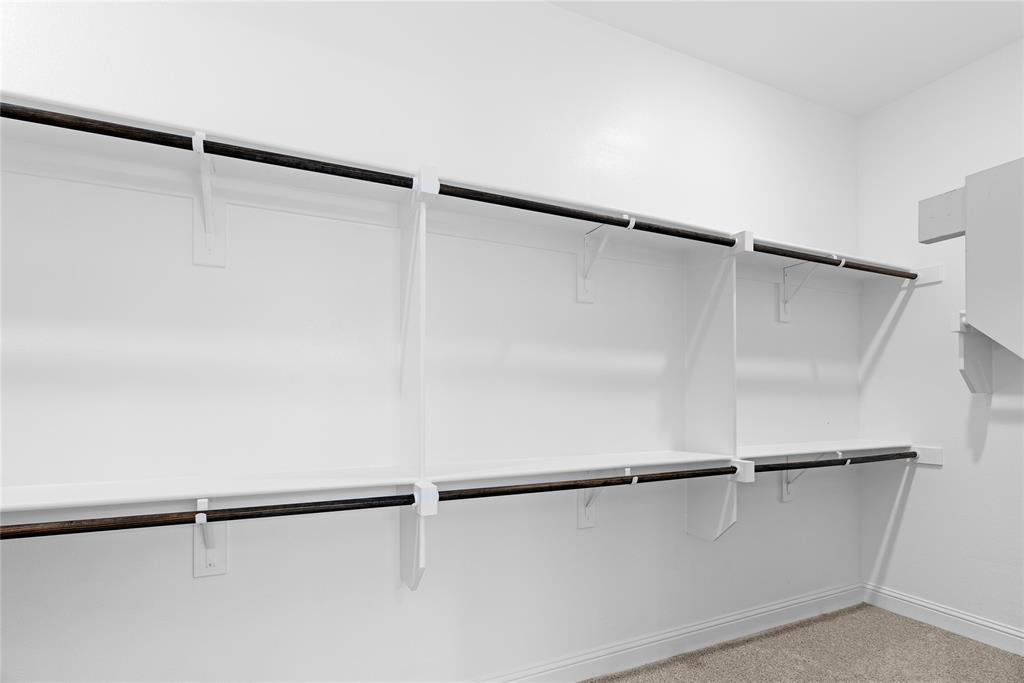 4405 Rosedale Street Prosper, TX 75078 - Photo 14 of 40 a view of an empty walk in closet