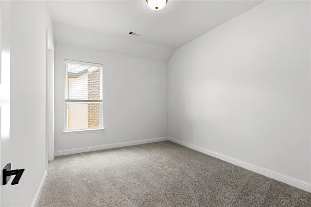 a spacious bathroom with a bathtub sink and mirror