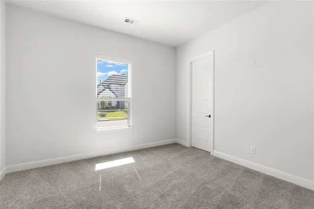 a bathroom with a toilet and shower