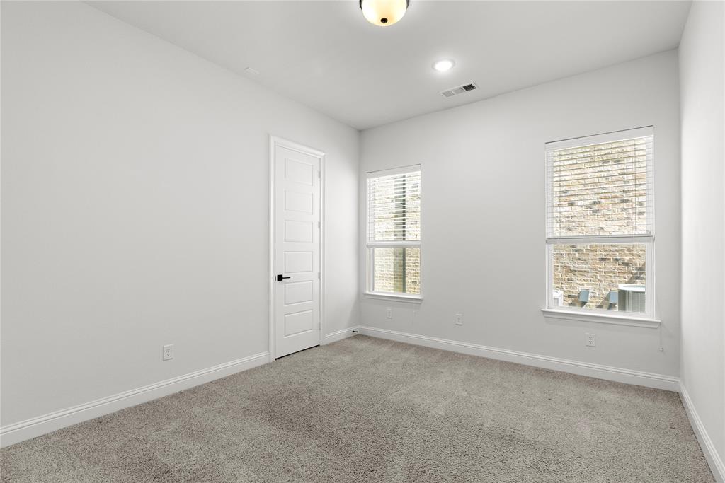4405 Rosedale Street Prosper, TX 75078 - Photo 18 of 40 an empty room with windows