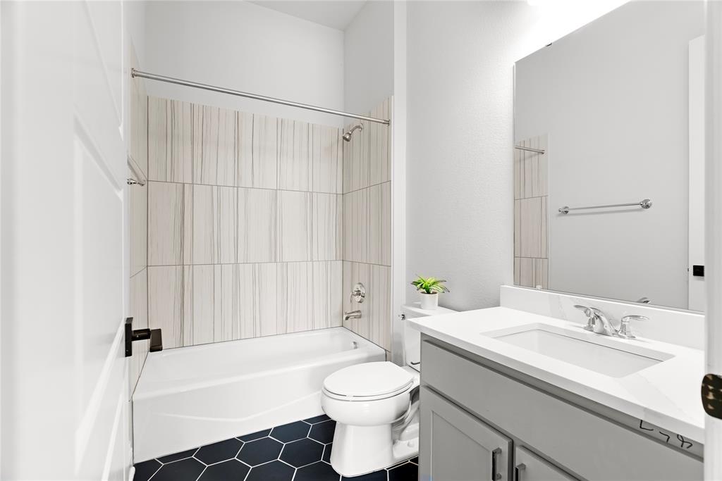 4405 Rosedale Street Prosper, TX 75078 - Photo 19 of 40 a bathroom with a sink toilet and shower