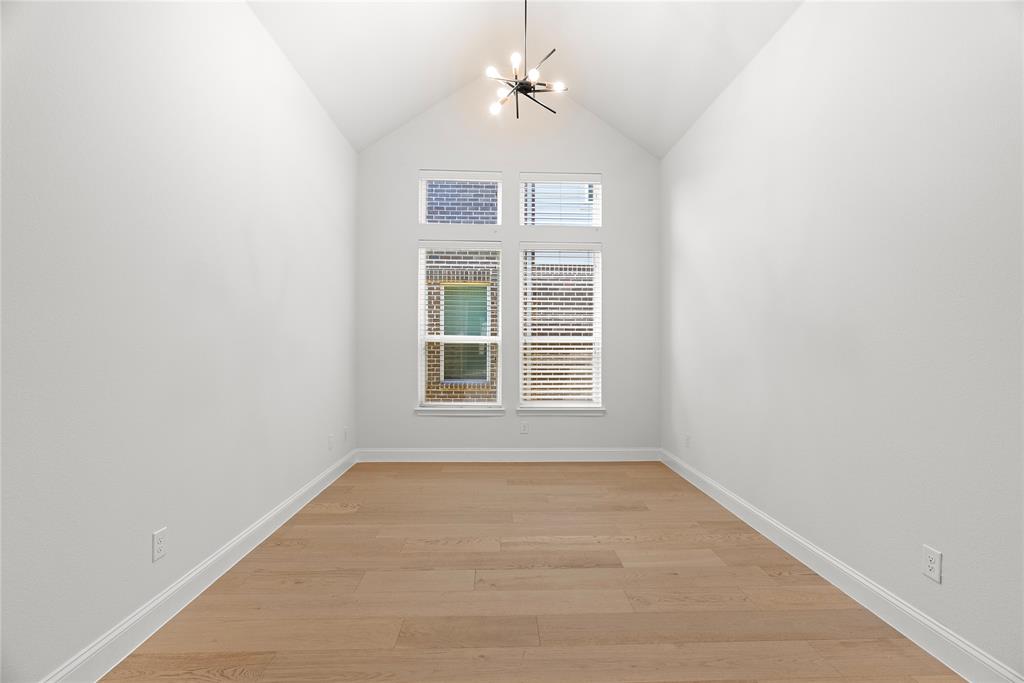 4405 Rosedale Street Prosper, TX 75078 - Photo 25 of 40 an empty room with a window and a ceiling fan