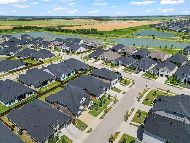an aerial view of a houses with outdoor space