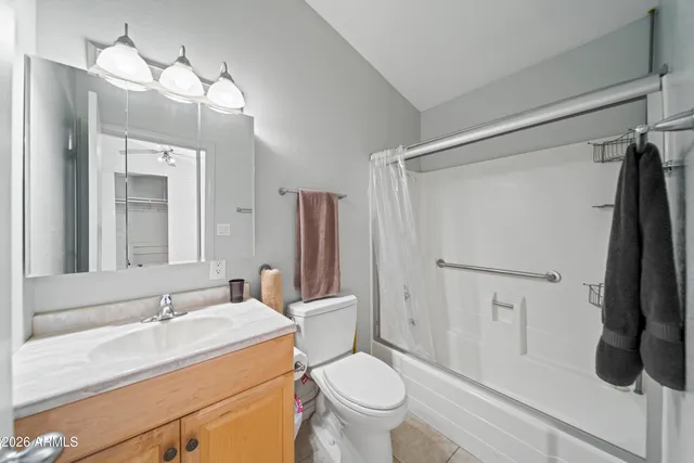 a bedroom with a bed and a desk