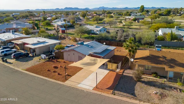 an aerial view of a house with a ocean view