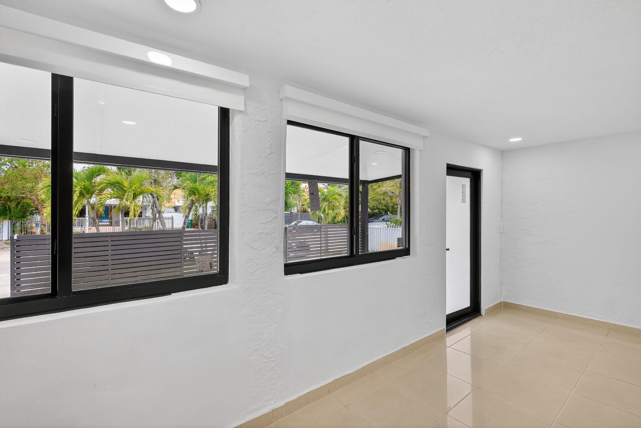 2244 Southwest 10th Street Miami, FL 33135 - Photo 12 of 40 an empty room with large windows