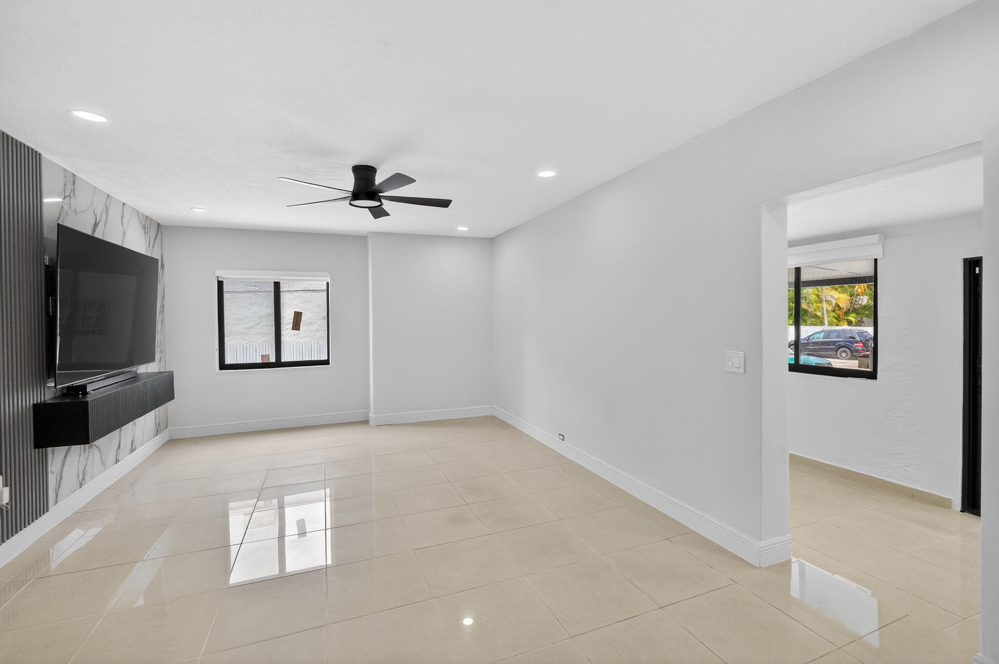 2244 Southwest 10th Street Miami, FL 33135 - Photo 13 of 40 a view of livingroom with hardwood floor and a ceiling fan