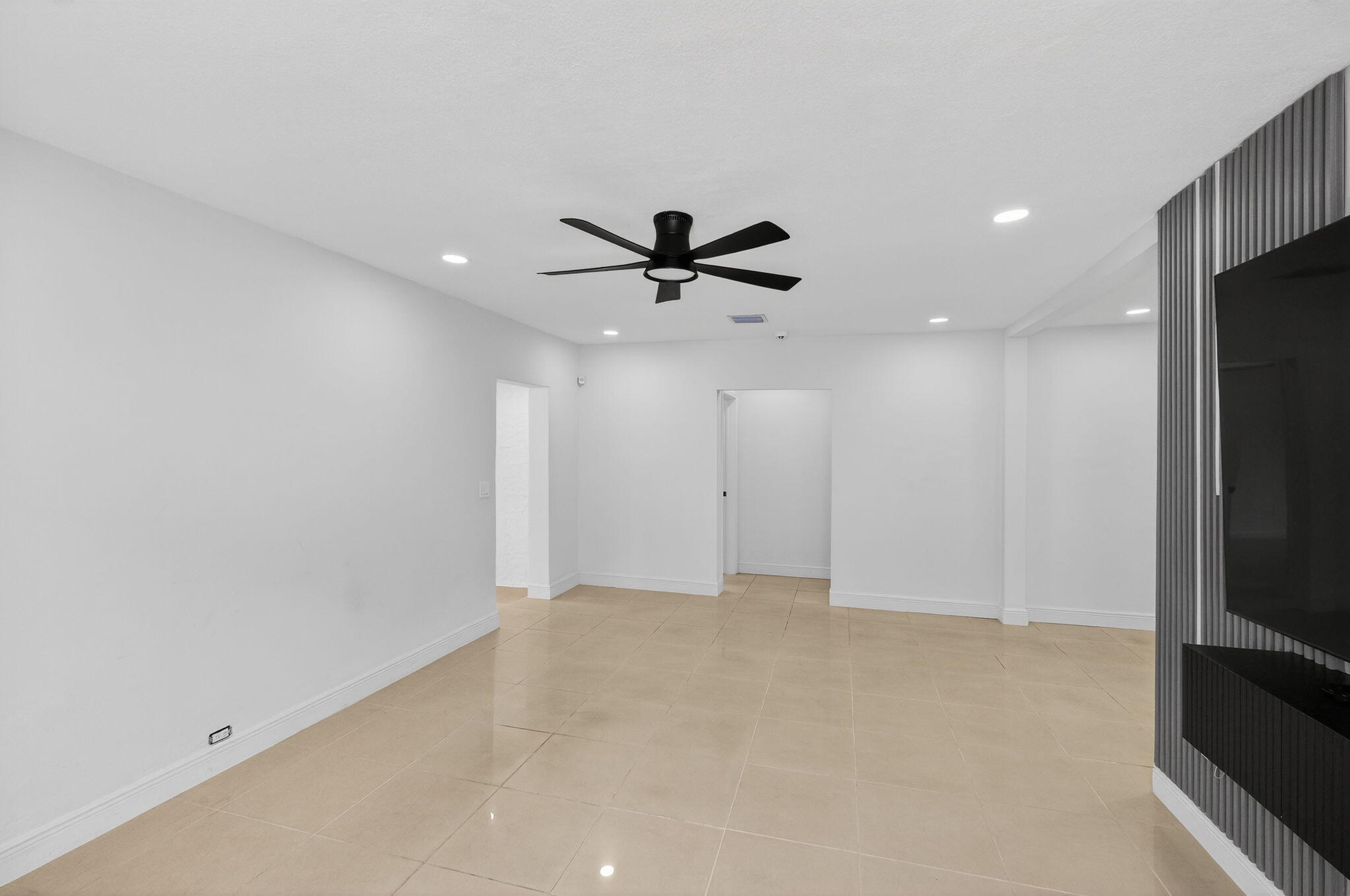 2244 Southwest 10th Street Miami, FL 33135 - Photo 16 of 40 an empty room with closet and ceiling fan