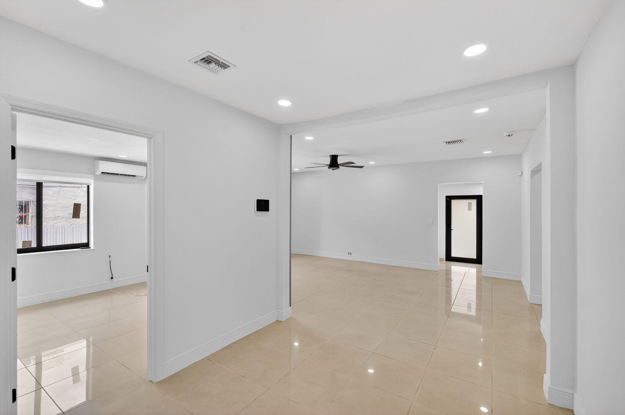 2244 Southwest 10th Street Miami, FL 33135 - Photo 17 of 40 a view of a hallway with wooden staircase