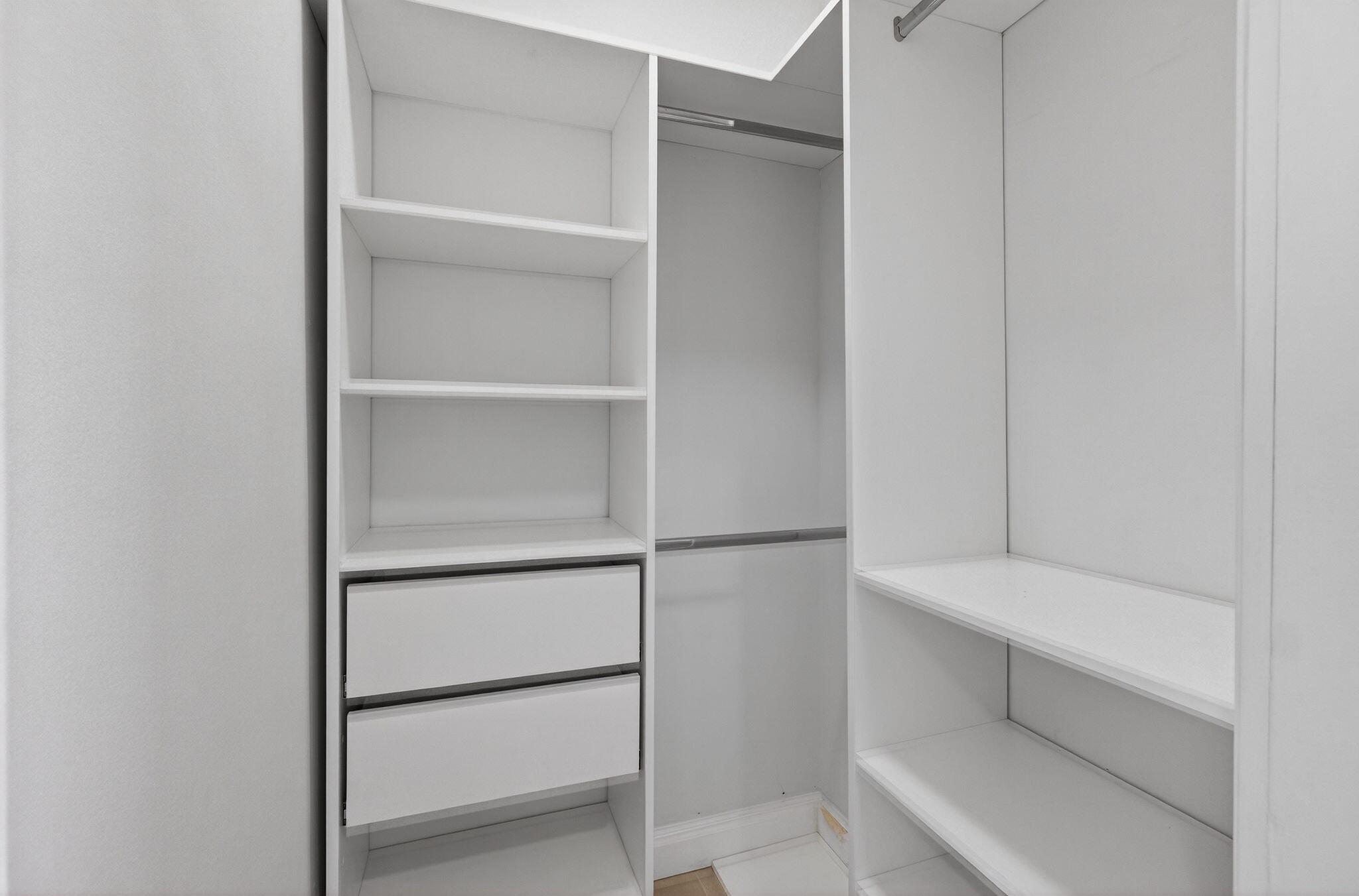 2244 Southwest 10th Street Miami, FL 33135 - Photo 29 of 40 a view of walk in closet with empty racks