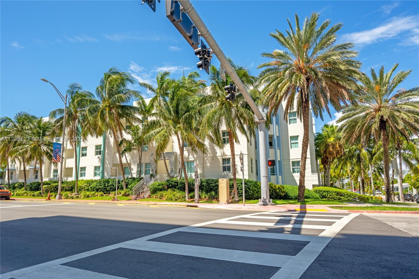 9172 Collins Avenue, Unit 403 Surfside, FL 33154 - Photo 1 of 30 a view of a palm trees front of a building