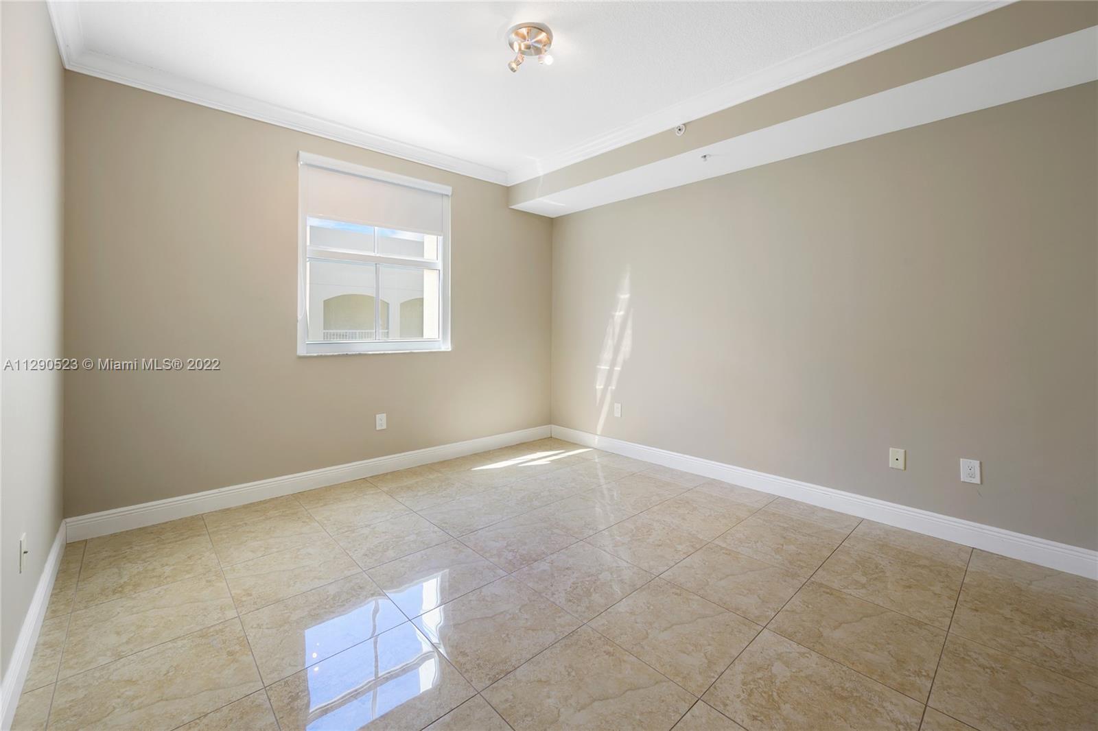 9172 Collins Avenue, Unit 403 Surfside, FL 33154 - Photo 15 of 30 a view of an empty room with a window