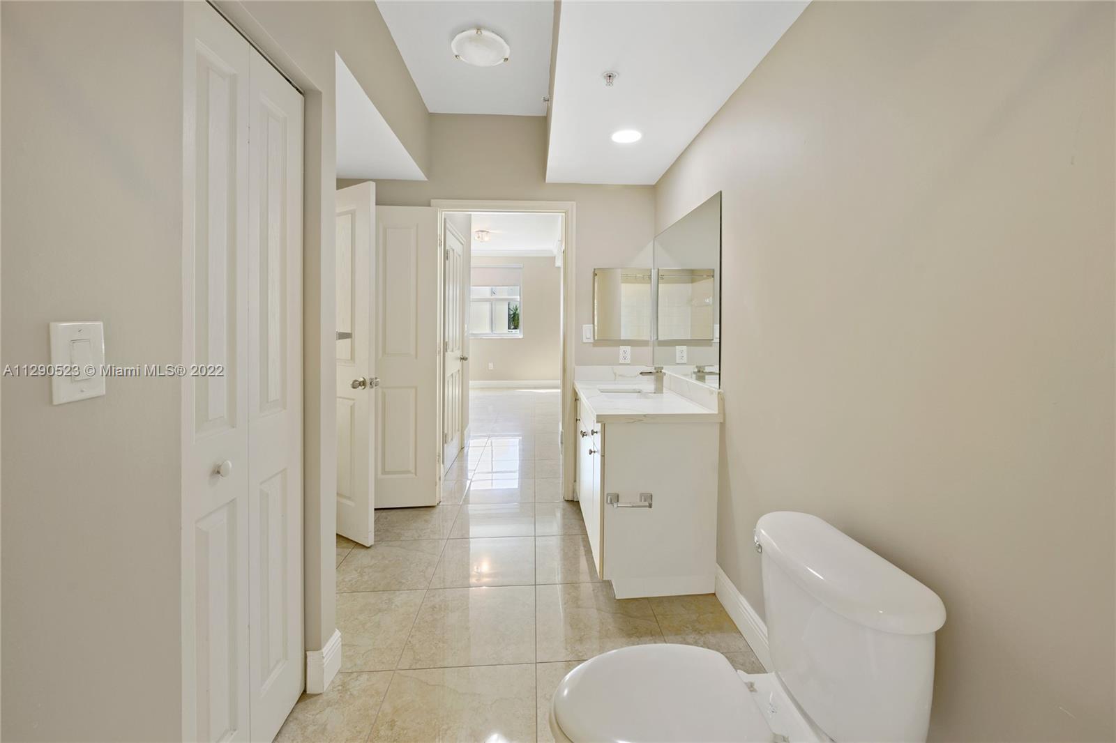9172 Collins Avenue, Unit 403 Surfside, FL 33154 - Photo 20 of 30 a bathroom with a toilet and a shower