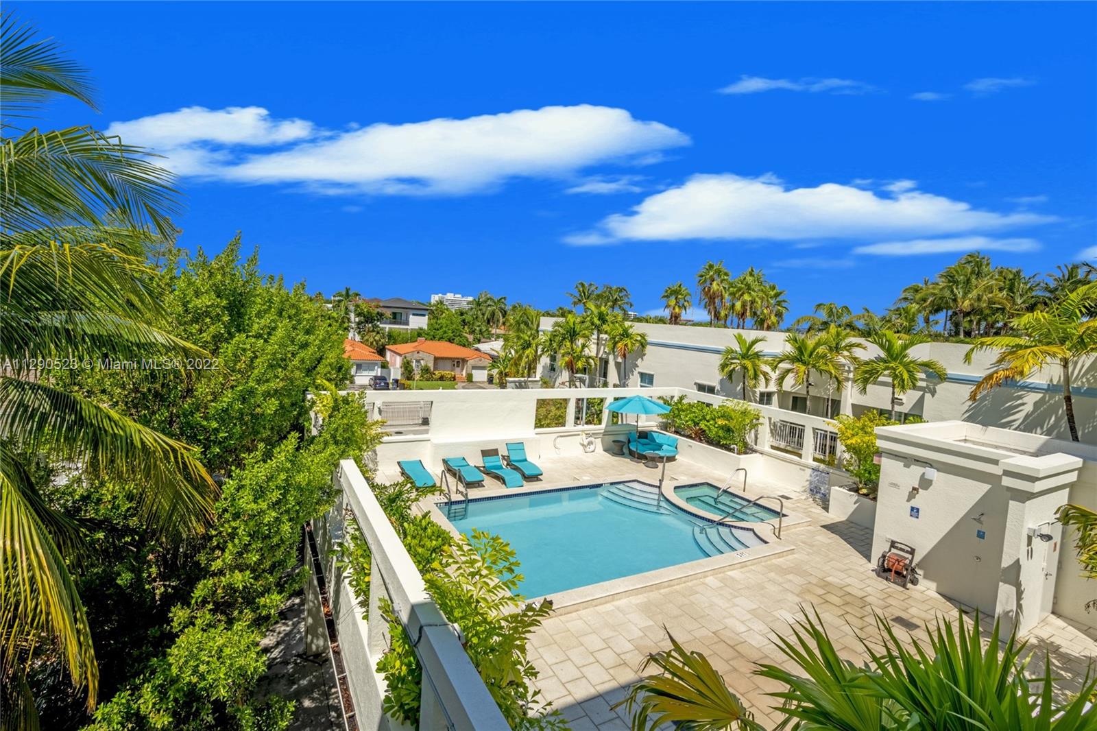 9172 Collins Avenue, Unit 403 Surfside, FL 33154 - Photo 23 of 30 a view of a balcony with two chairs and a table