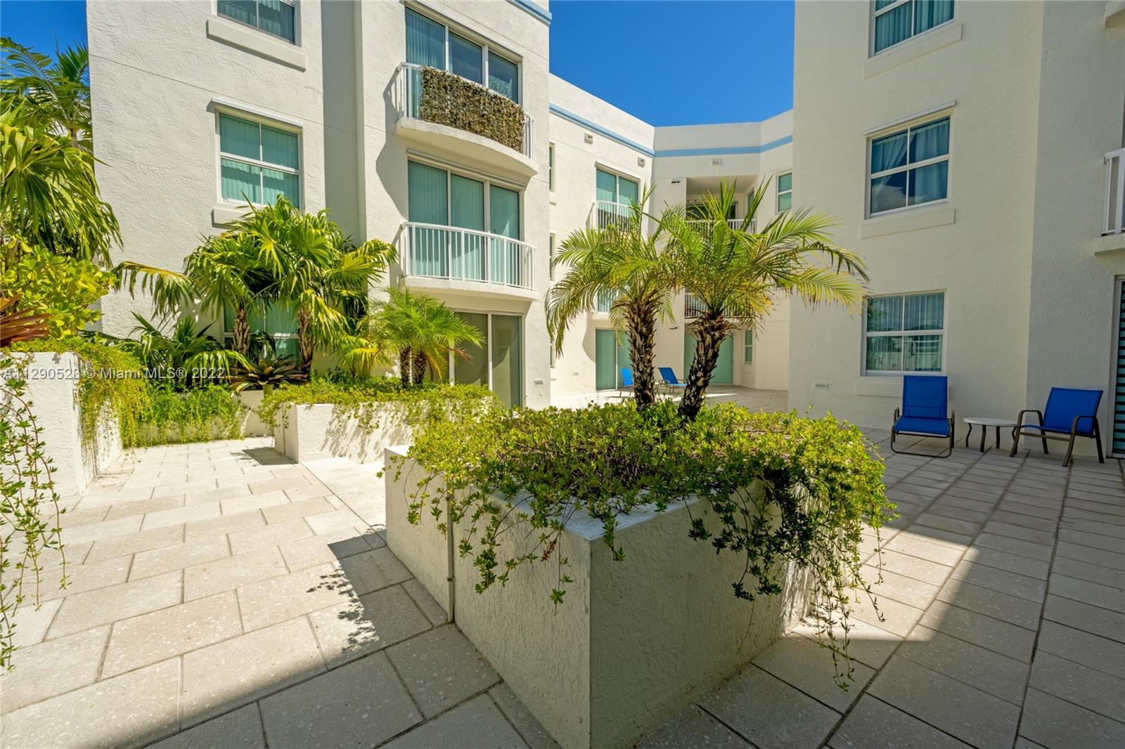 9172 Collins Avenue, Unit 403 Surfside, FL 33154 - Photo 24 of 30 a front view of a multi story residential apartment building