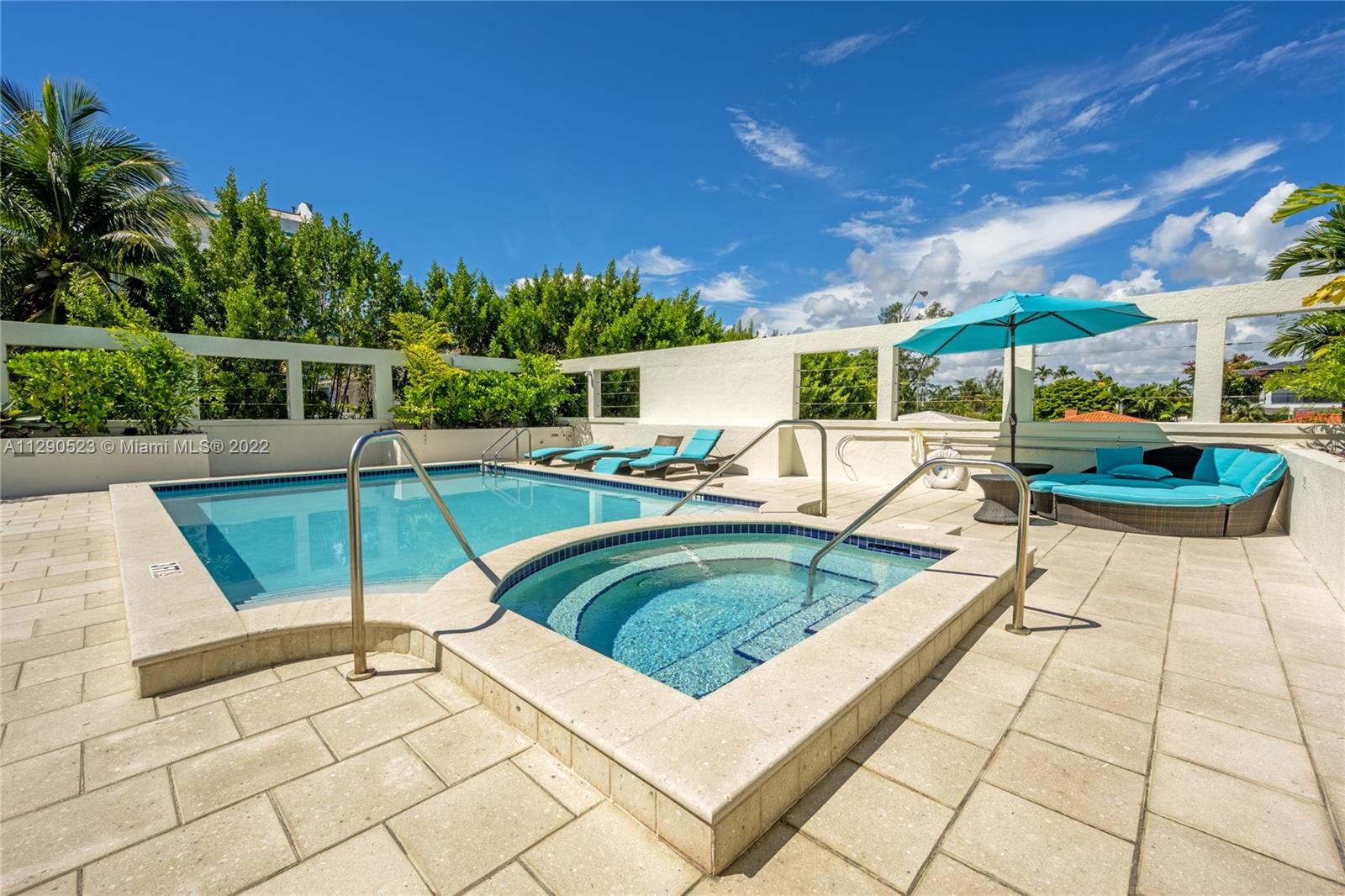 9172 Collins Avenue, Unit 403 Surfside, FL 33154 - Photo 26 of 30 a view of a swimming pool with a patio