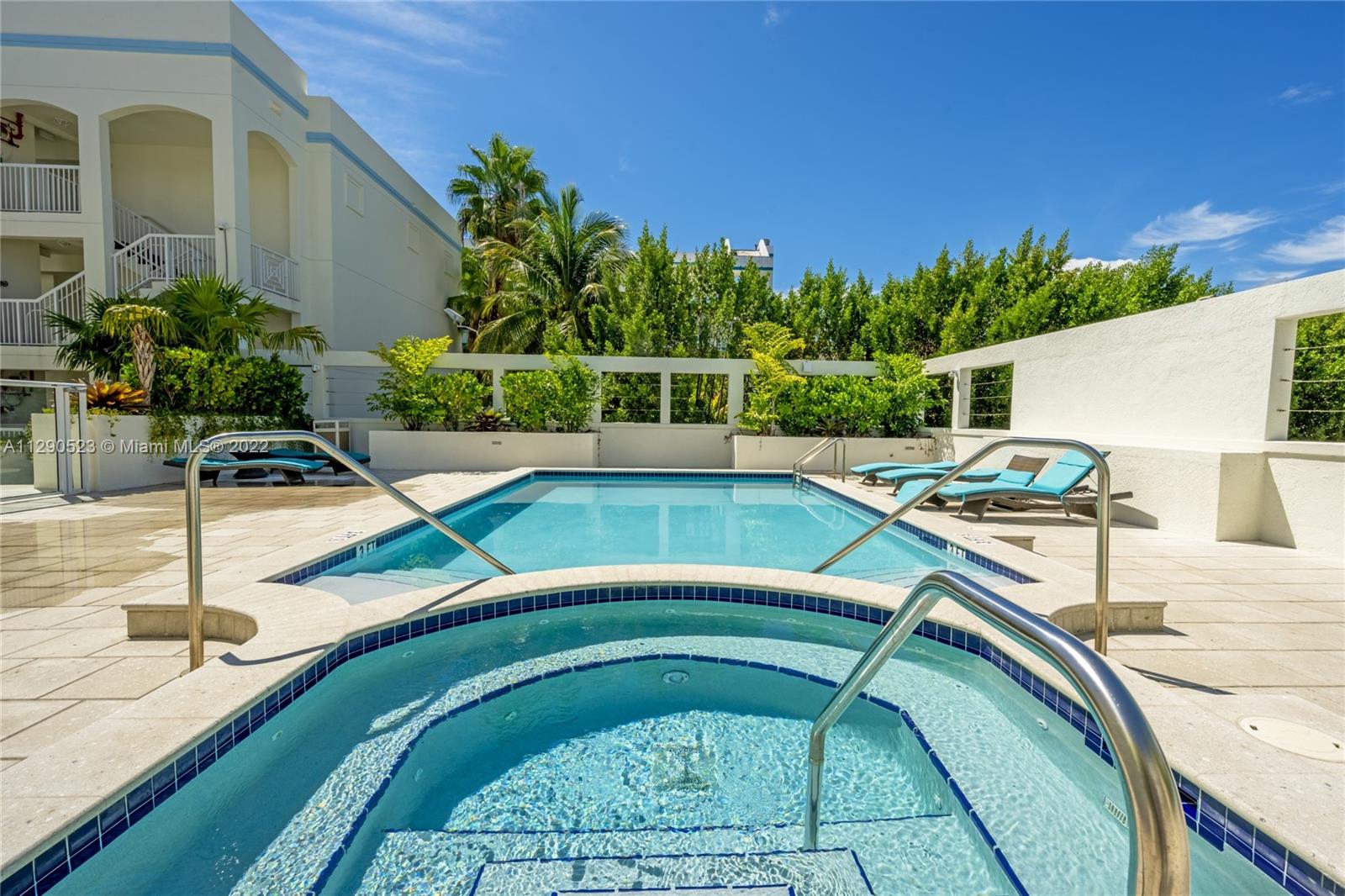 9172 Collins Avenue, Unit 403 Surfside, FL 33154 - Photo 28 of 30 a view of a swimming pool with a patio