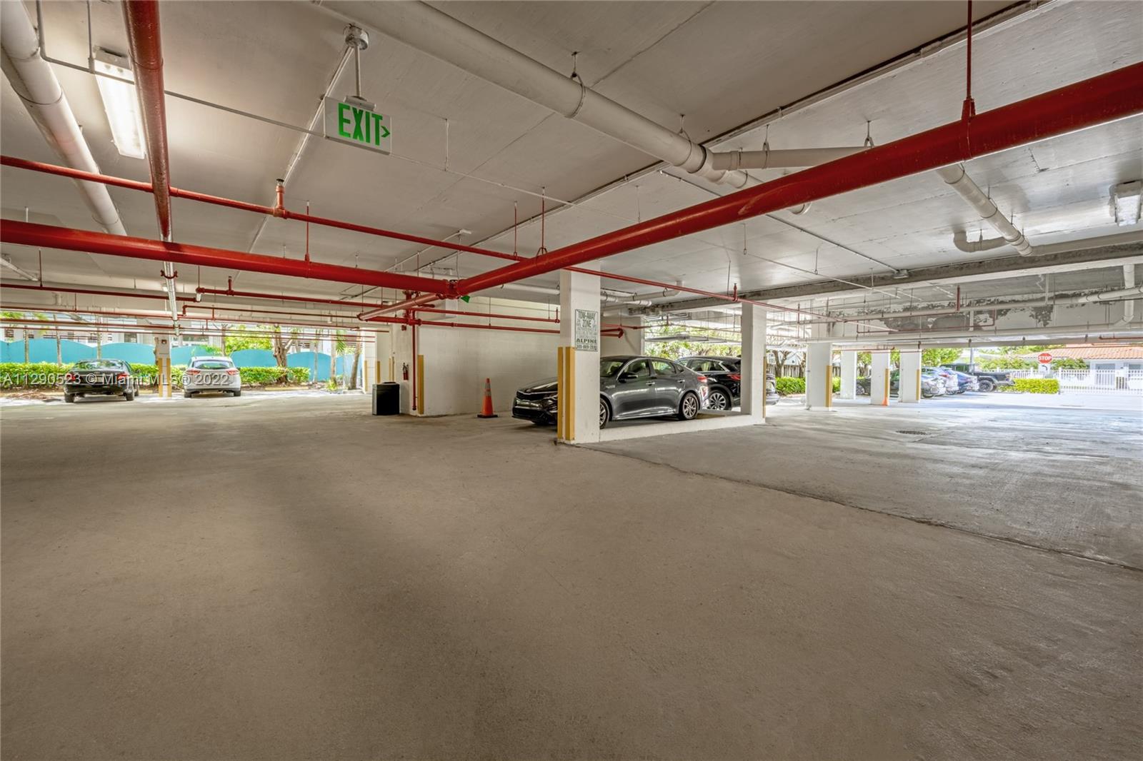 9172 Collins Avenue, Unit 403 Surfside, FL 33154 - Photo 30 of 30 a view of a garage with wooden floor
