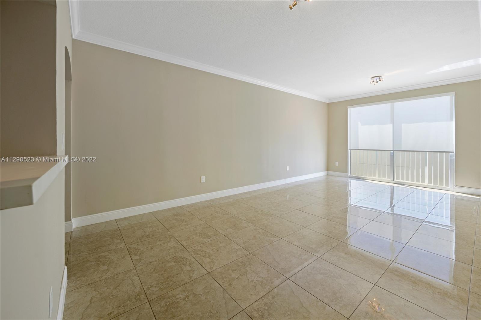 9172 Collins Avenue, Unit 403 Surfside, FL 33154 - Photo 7 of 30 a view of an empty room with a window