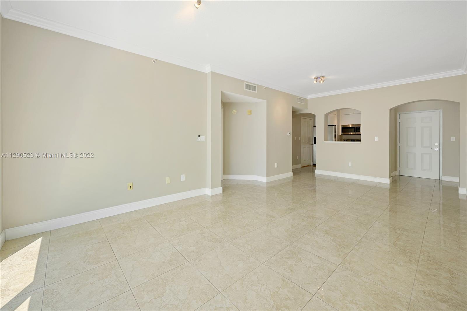 9172 Collins Avenue, Unit 403 Surfside, FL 33154 - Photo 8 of 30 an empty room with a natural light