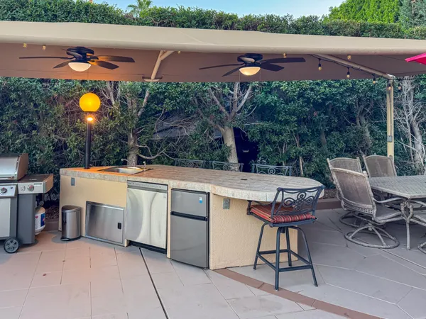 a view of a chairs and table in the terrace