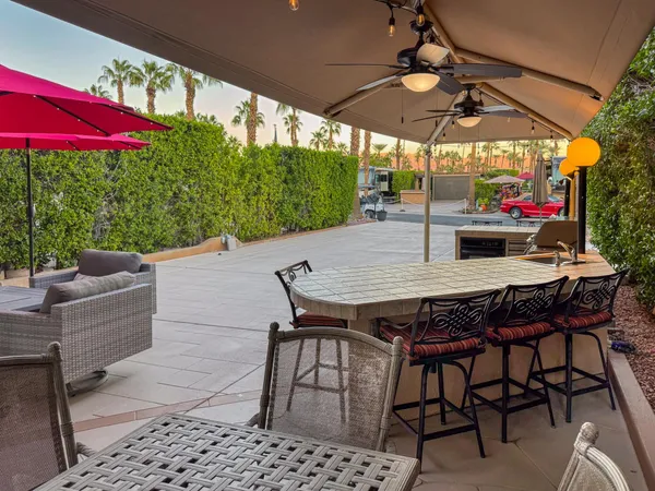 an outdoor space with patio furniture