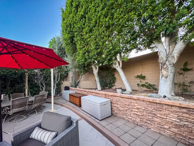a view of pool with seating area and barbeque oven