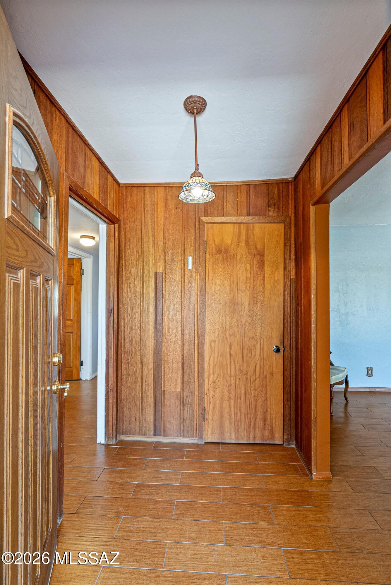 2107 East Lind Road Tucson, AZ 85719 - Photo 6 of 43 a view of a room with a door and a chandelier