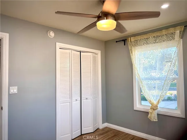 a kitchen with granite countertop a sink stove and cabinets