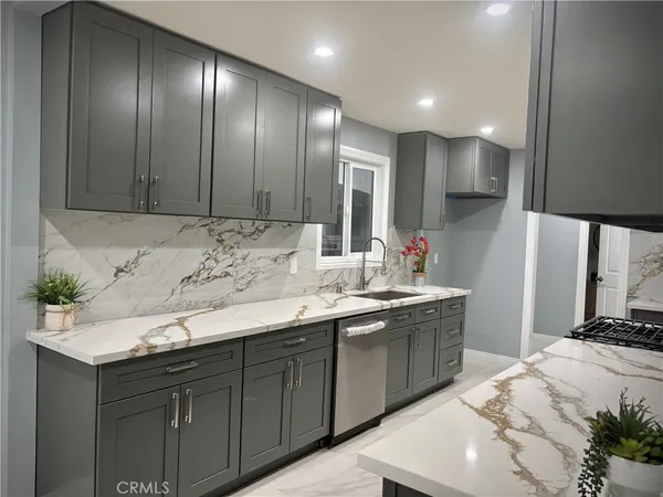 a kitchen with a sink and cabinets