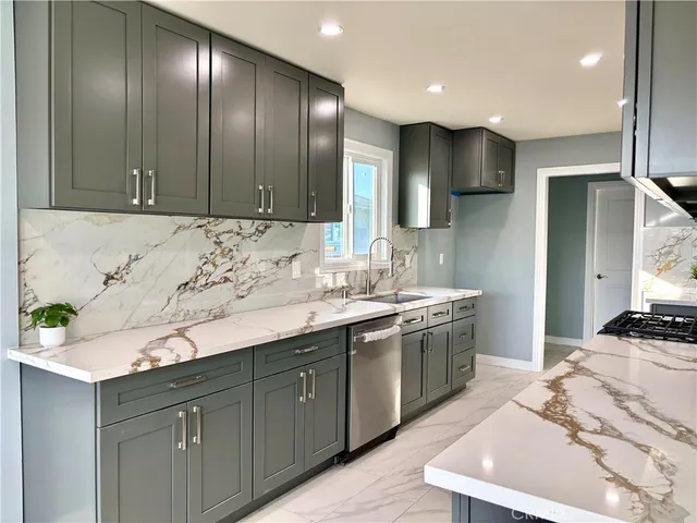 a kitchen with a sink and cabinets