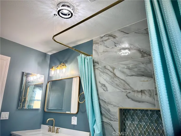 a bathroom with a sink and mirror