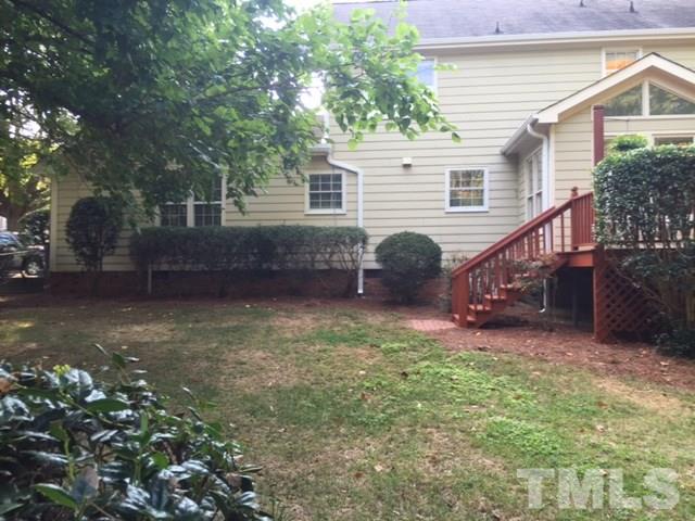 7909 Harps Mill Road Raleigh, NC 27615 - Photo 22 of 25 a view of a house with a yard