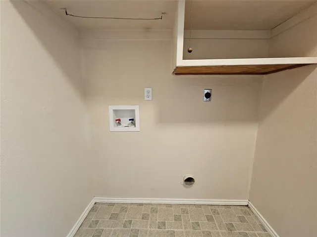 a view of a livingroom with a ceiling fan and window