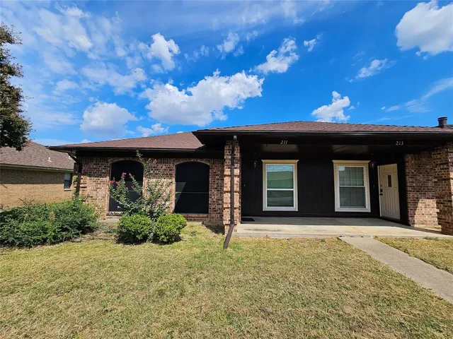 front view of a house with a small yard
