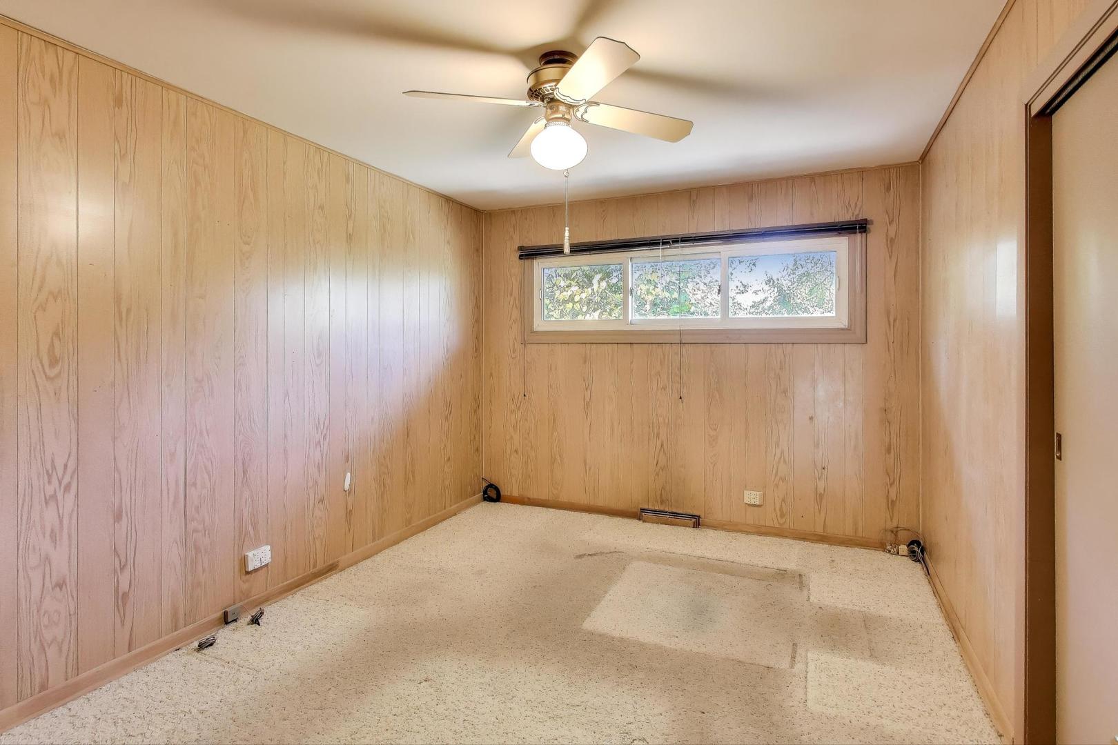 313 Ferndale Road Glenview, IL 60025 - Photo 11 of 22 an empty room with windows and fan