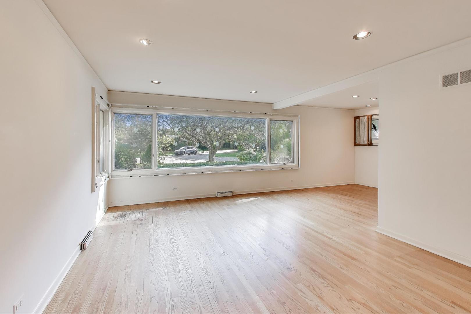313 Ferndale Road Glenview, IL 60025 - Photo 3 of 22 an empty room with wooden floor and windows