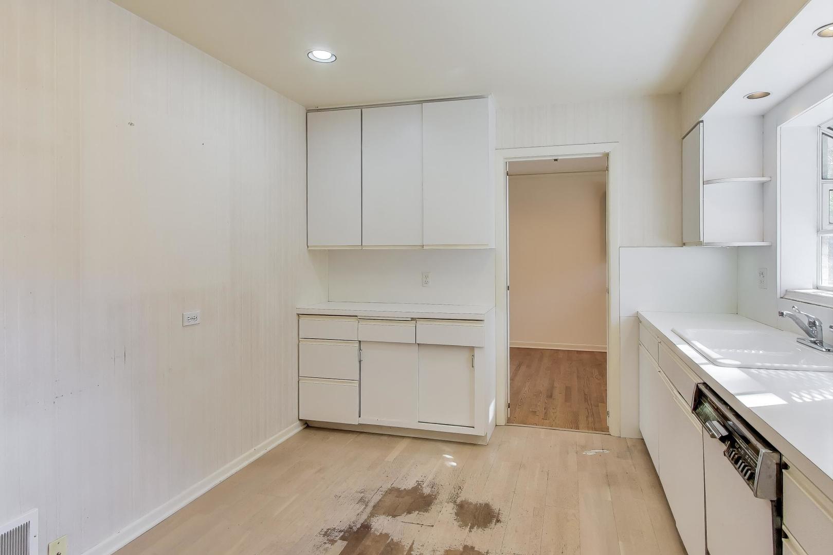 313 Ferndale Road Glenview, IL 60025 - Photo 7 of 22 a view of a kitchen with a sink and a stove top oven