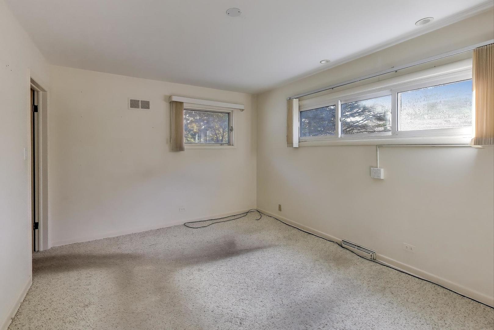 313 Ferndale Road Glenview, IL 60025 - Photo 9 of 22 a view of an empty room with a window