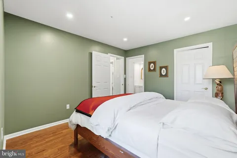 a bedroom with a bed and a lamp