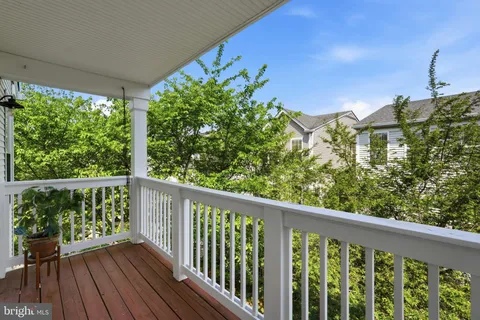 a view of a balcony with wooden floor