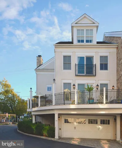a view of a dining room and livingroom with furniture wooden floor and a rug