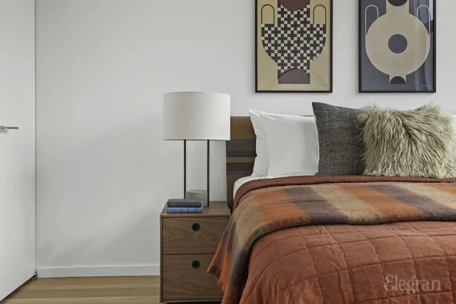 a bedroom with a bed and a cabinets