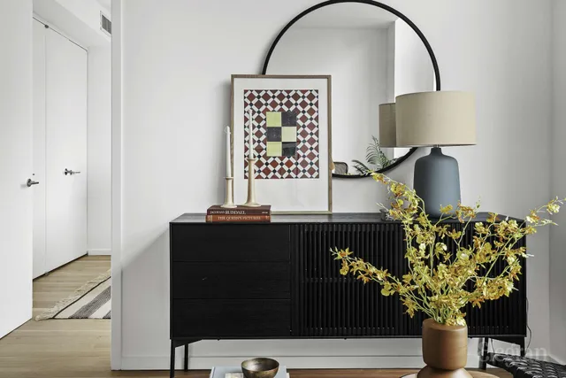 a living room with furniture and a floor to ceiling window