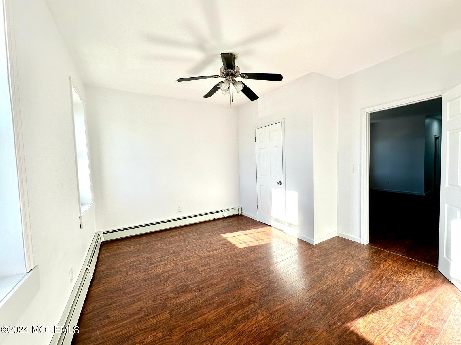 462 Compton Avenue, Unit THIRD Perth Amboy, NJ 08861 - Photo 3 of 14 a view of empty room with wooden floor