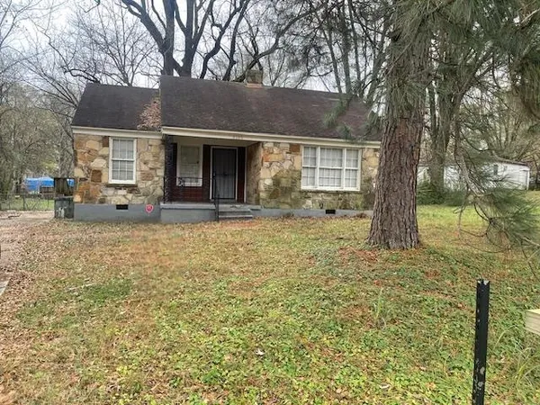 a front view of house with yard outdoor seating and barbeque oven