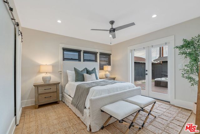 a bedroom with a bed and a lamp