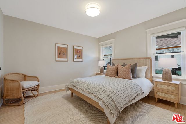 a bedroom with a bed and a chair