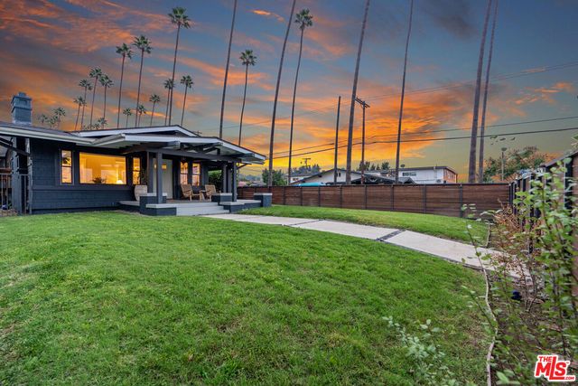 a view of a house with a big yard