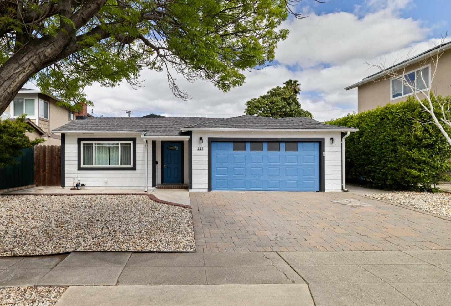 front view of a house with a yard